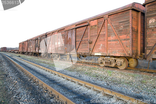 Image of old rusty train wagons on railway