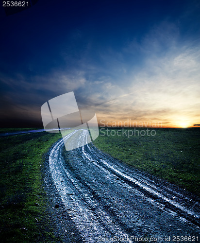 Image of dirty way in sunset after rain