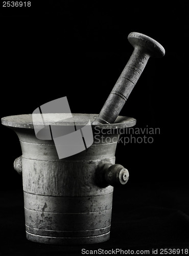 Image of Old mortar with pestle