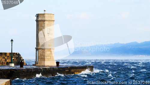 Image of Picture represents the lighthouse while blowing strong wind