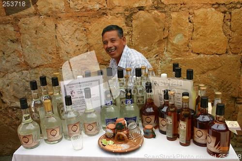 Image of Man with bottles of Mezcal, Mexico
