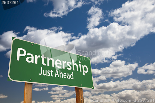 Image of Partnership Green Road Sign Over Clouds and Sky