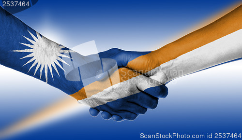 Image of Man and woman shaking hands