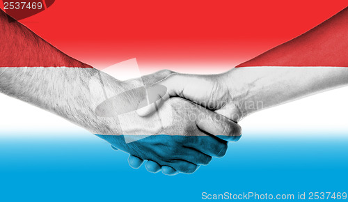 Image of Man and woman shaking hands