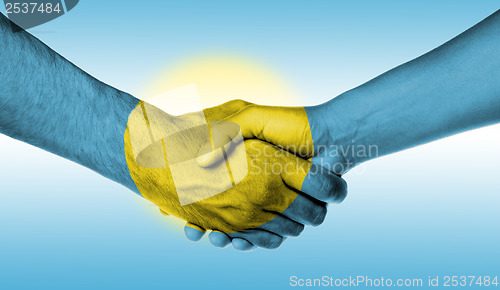 Image of Man and woman shaking hands