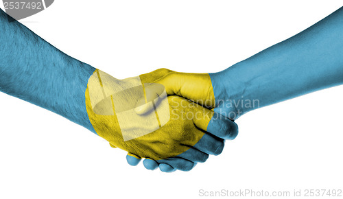 Image of Man and woman shaking hands