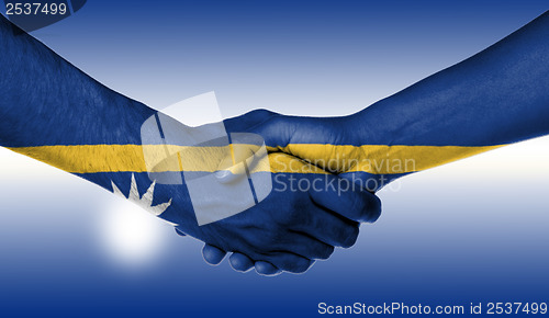 Image of Man and woman shaking hands