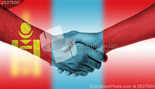 Image of Man and woman shaking hands