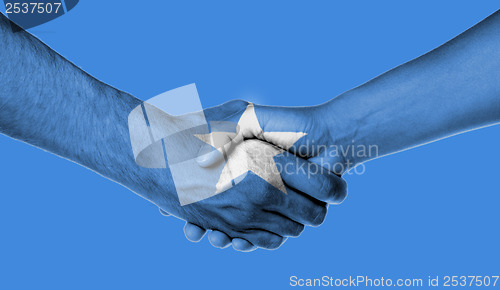 Image of Man and woman shaking hands