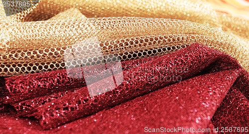 Image of Golden and red fabric