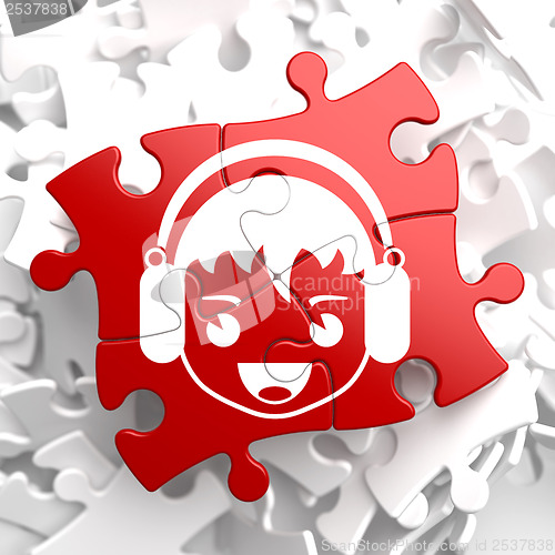 Image of Happy Boy with Headphones Icon on Red Puzzle.