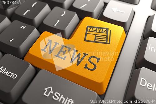 Image of News Concept on Orange Keyboard Button.