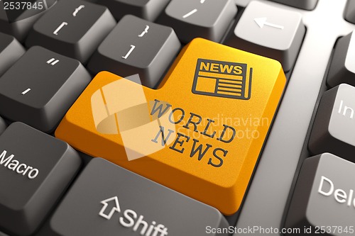 Image of World News Concept on Orange Keyboard Button.