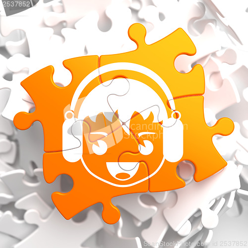 Image of Happy Boy with Headphones Icon on Orange Puzzle.