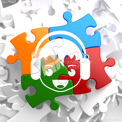 Image of Boy with Headphones Icon on Multicolor Puzzle.