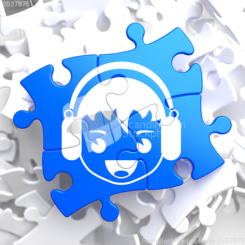 Image of Boy with Headphones Icon on Blue Puzzle.