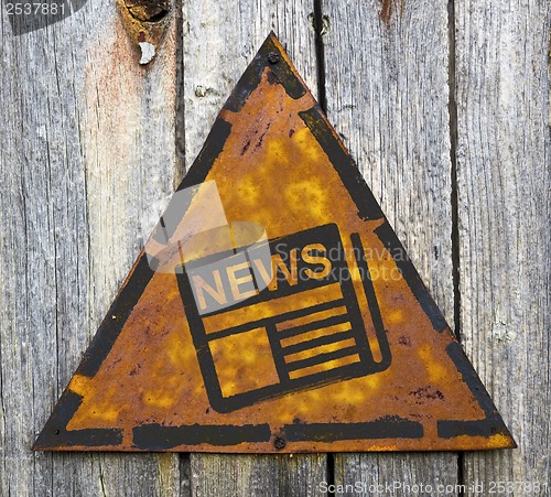 Image of News Concept on Rusty Warning Sign.