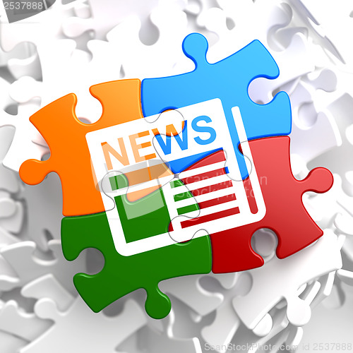 Image of Newspaper with News Title on Multicolor Puzzle.