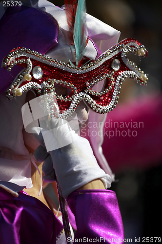 Image of Person holding a mask upto their face