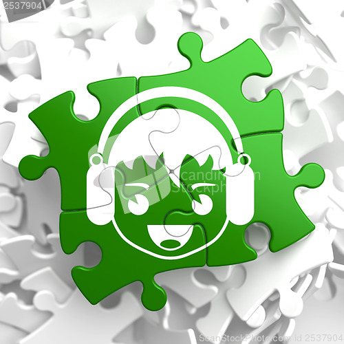 Image of Happy Boy with Headphones Icon on Green Puzzle.