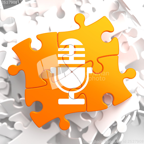 Image of Microphone Icon on Orange Puzzle.