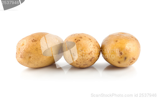 Image of Three raw potatoes isolated on a white