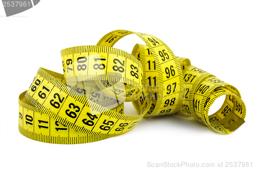 Image of Curled yellow measuring tape on white background