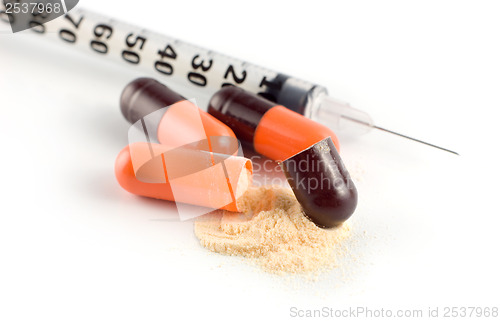 Image of Capsule and syringe