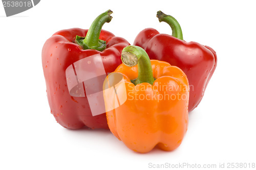Image of Two red and one orange pepper