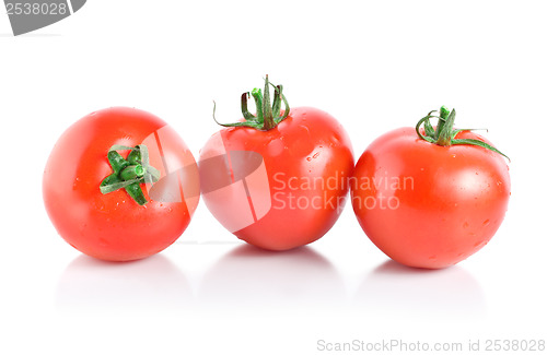 Image of Three mellow red tomatoes