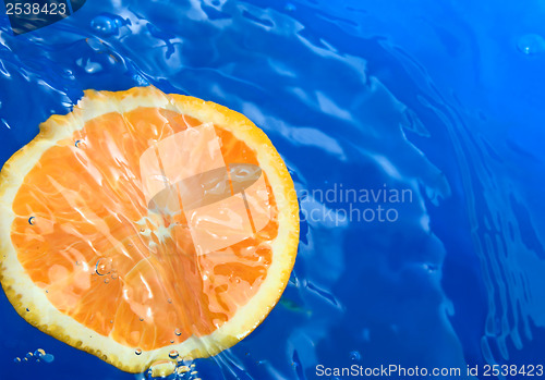 Image of Orange in blue water