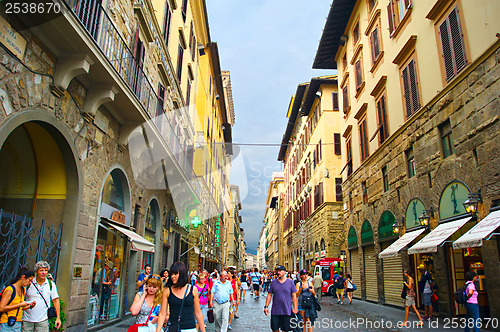 Image of Tourists walking in crowded street in Florence