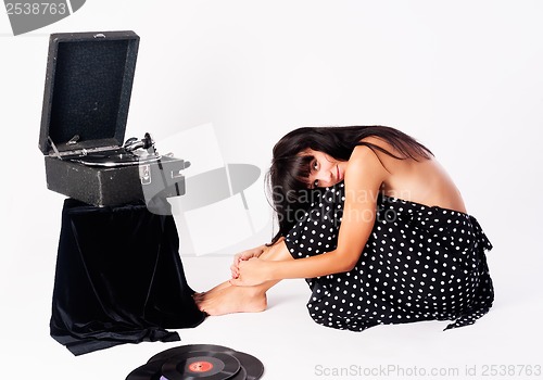 Image of Pretty woman with gramophone