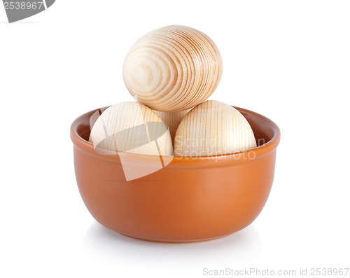 Image of Wooden easter eggs on a plate