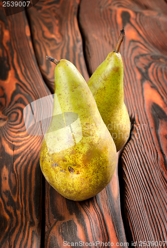 Image of Two pears on an old wooden background