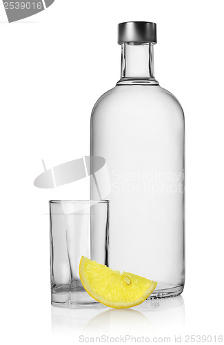 Image of Bottle of vodka and lemon isolated