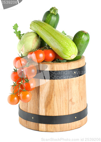 Image of Wooden barrel with vegetables isolated