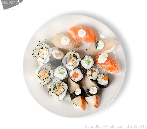 Image of Sushi and rolls in a plate isolated