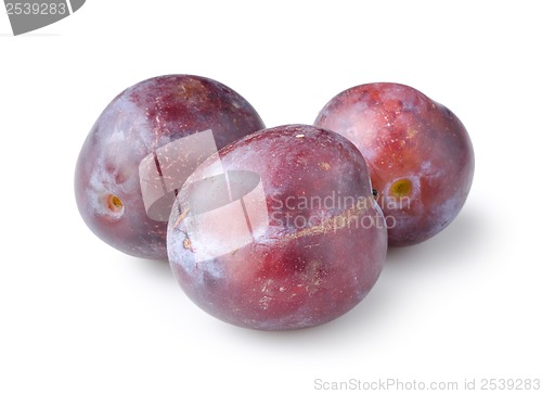 Image of Three plums isolated