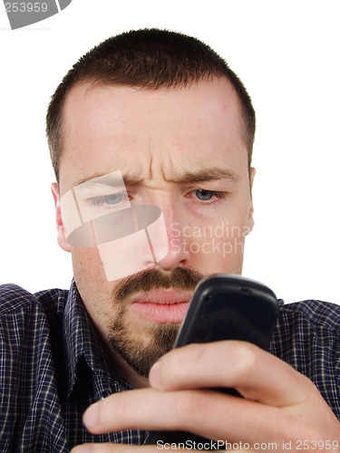 Image of Young man typing a short text message