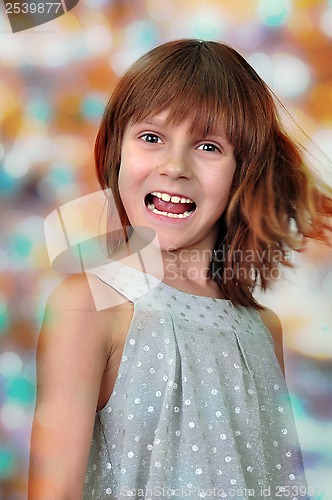 Image of holiday portrait of happy child against bright background