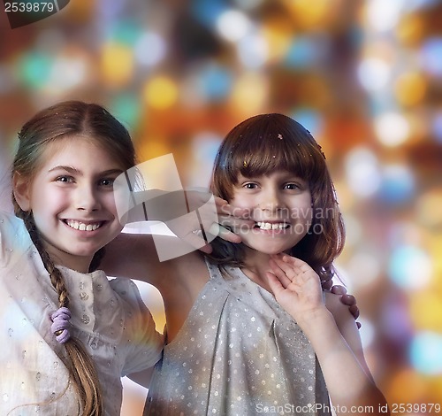 Image of holiday portrait of happy children against bright background