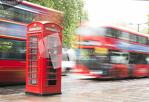 Image of Red Phone cabine and bus in London. 