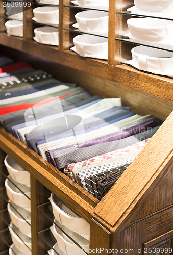 Image of Ties stacked on a shelf in a store