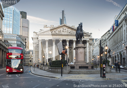 Image of Red Bus in motion in City of London