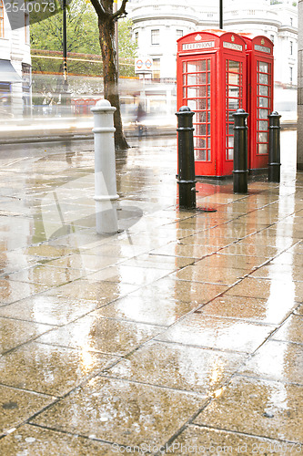 Image of Rainy day.Red Phone cabines in London