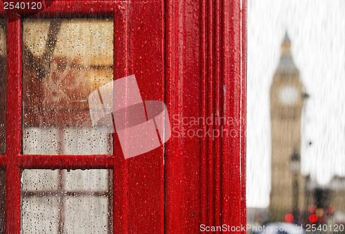 Image of Big ben and red phone cabine. Rainy day