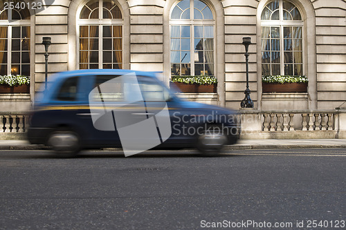 Image of Taxi in motion in London
