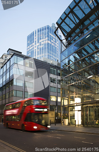 Image of Red Bus in motion in City of London