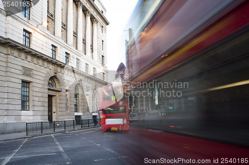 Image of Red Bus in motion in City of London